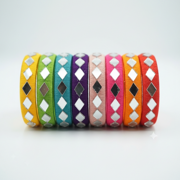 A set of eight colorful leather wrap bracelets with silver and black diamond-shaped metallic studs, arranged in a row on a light gray background.