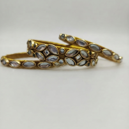 Handcrafted Falak antique gold kundan bangles showcasing intricate stone setting.